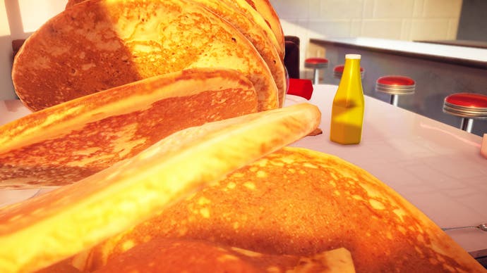 Una captura de pantalla del juego de comida Nour, que muestra los panqueques más grandes que el mundo haya visto jamás, apilados y cayendo hacia la cámara.  ¡Comer!