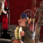 A toy monkey with dynamite attached is surrounded by zombies in Call of Duty: Warzone's Black Ops Royale mode